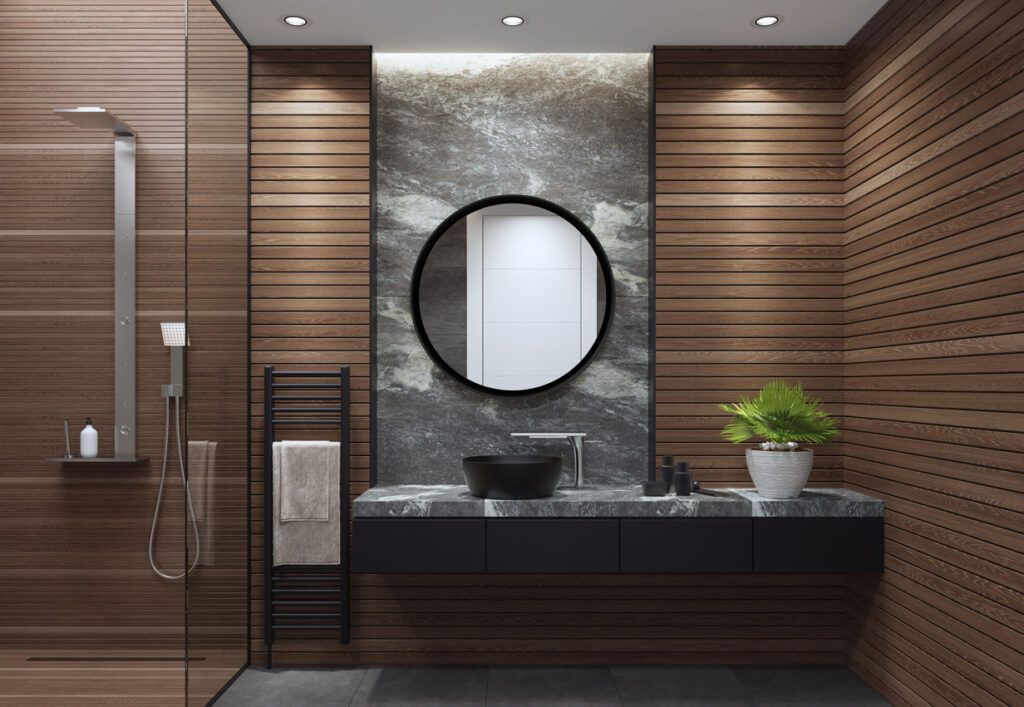 Luxe badkamer met ronde spiegel en inloopdouche